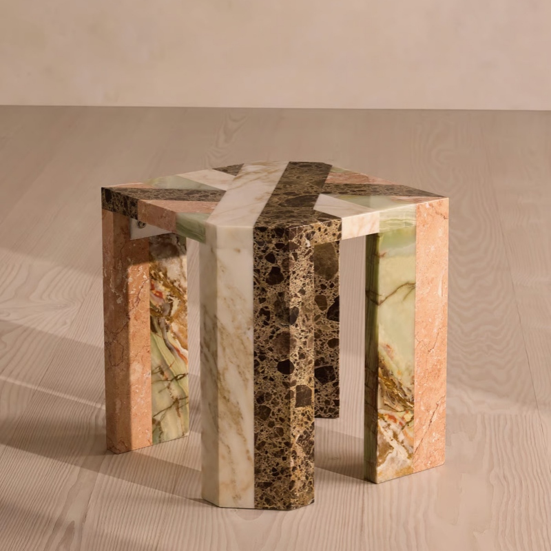 Angled view of multi-marble hexagon side table - layered stone pattern accent table