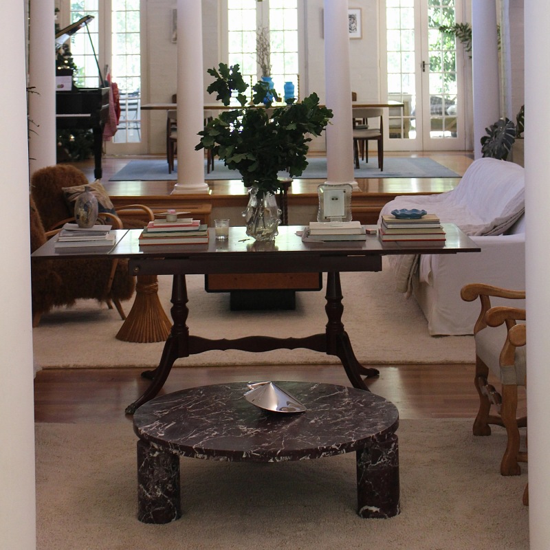 Burgundy marble coffee table in spacious living room - paired with sofa & seating furniture
