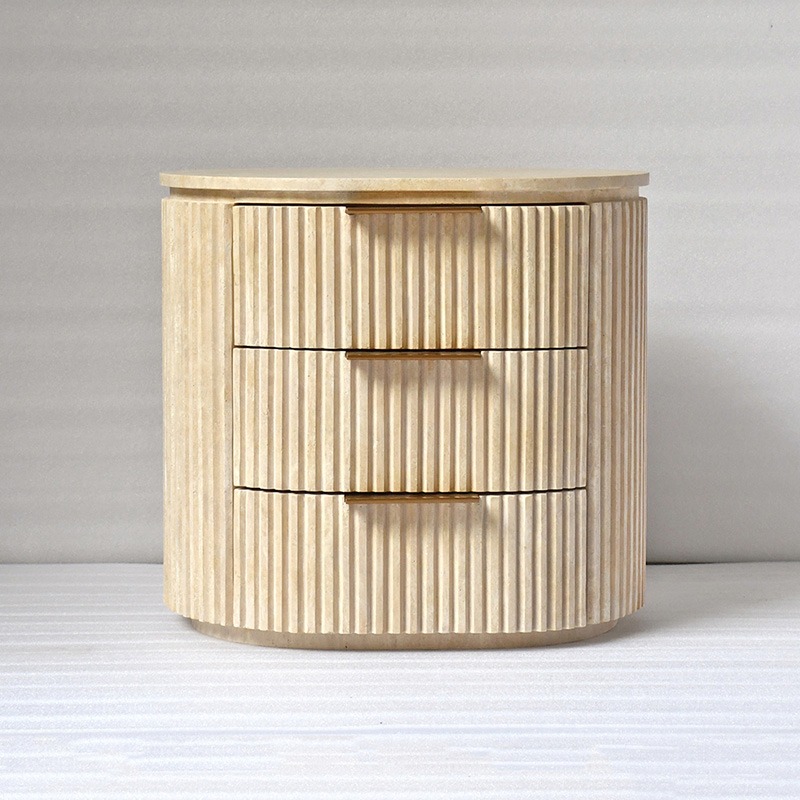 Three-drawer round travertine nightstand - sculptural organic design with brass hardware