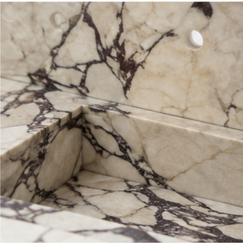 Freestanding Calacatta Viola marble bathroom vanity with full matching marble backsplash