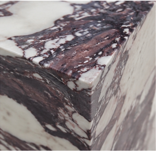 Close-up polished Calacatta Viola marble vanity corner, dramatic burgundy dark purple veining on creamy white base