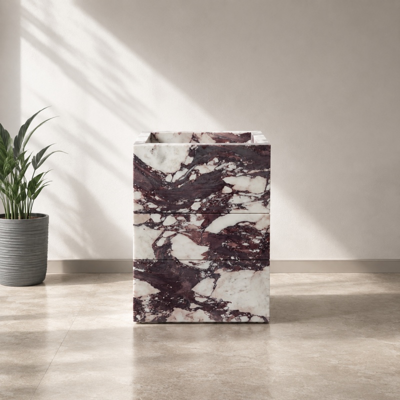 Cube-shaped Calacatta Viola stone vanity cabinet with open drawers, natural marble matching drawer wrap