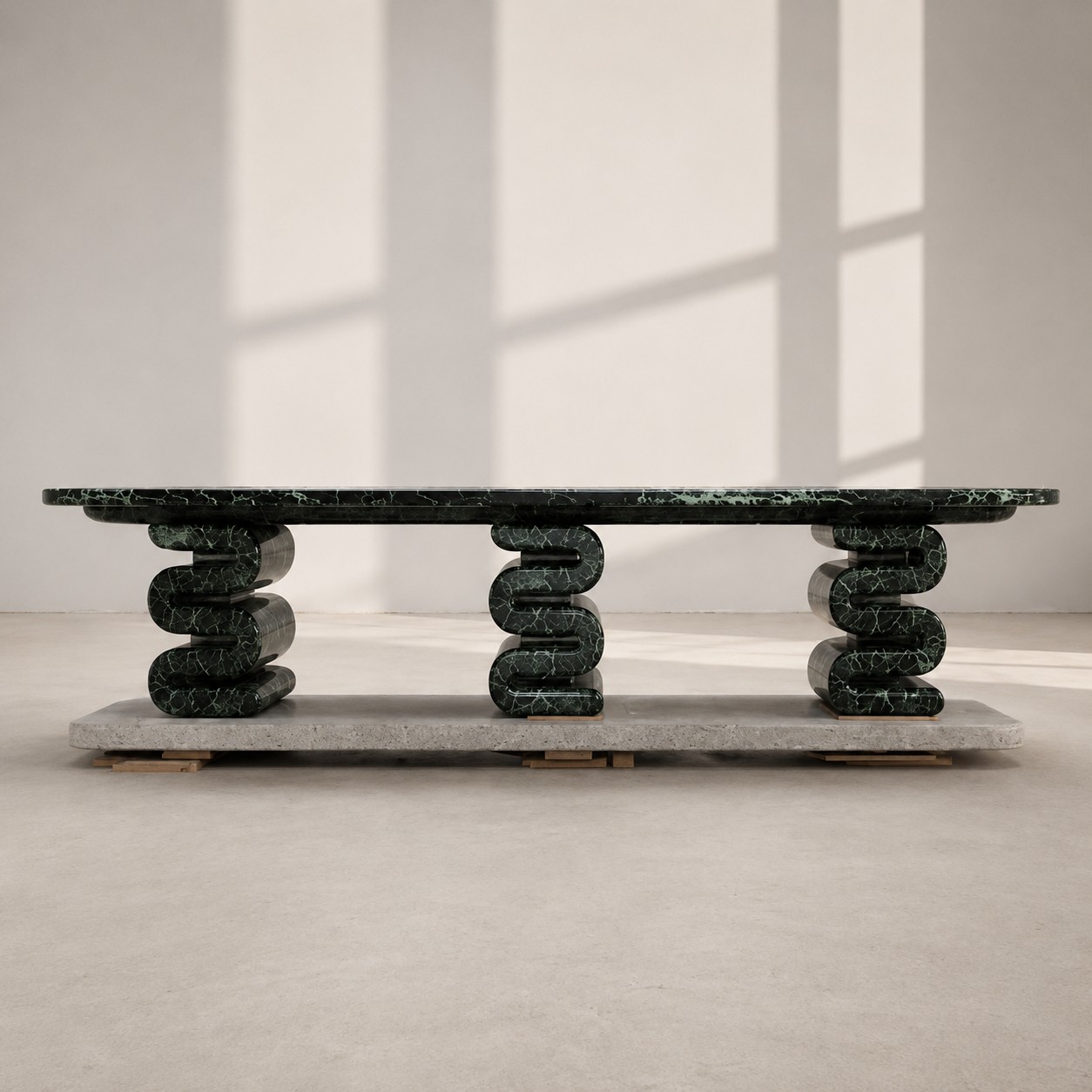 Close-up polished Verde Alpi marble table leg, dark emerald green base with fine white spider veining