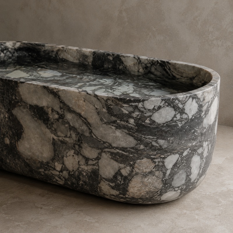 Close up of polished Calacatta Viola marble bathtub rim and breccia texture